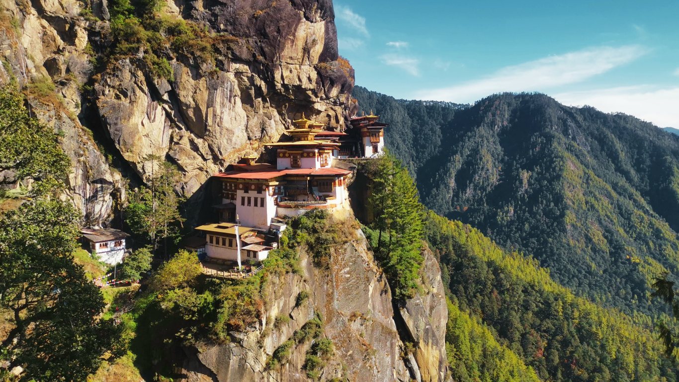 Paro Taktsang rises dramatically above the forests of Paro Valley