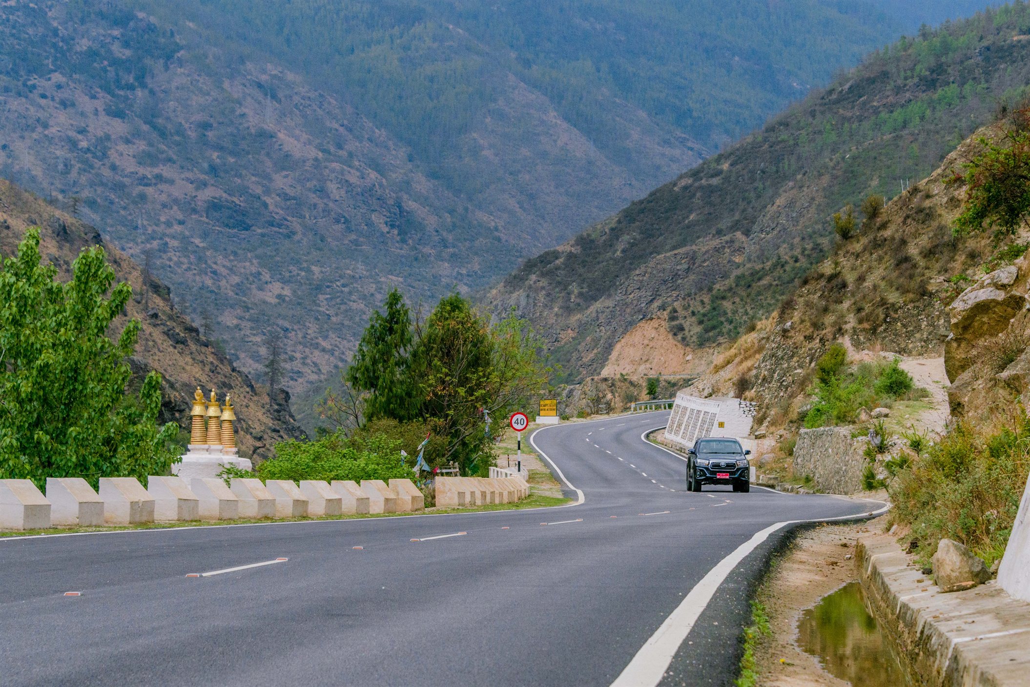Travel Bhutan comfortably through scenic mountain roads