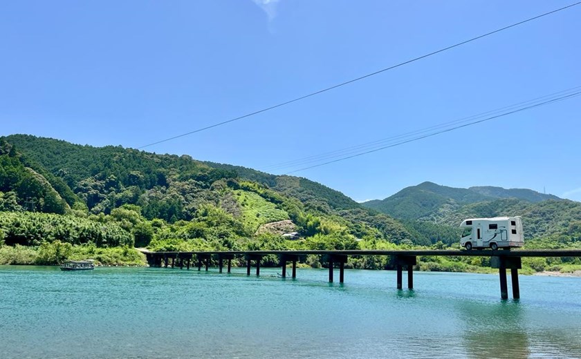 Campervan overlooking a beautiful lake view in Japan