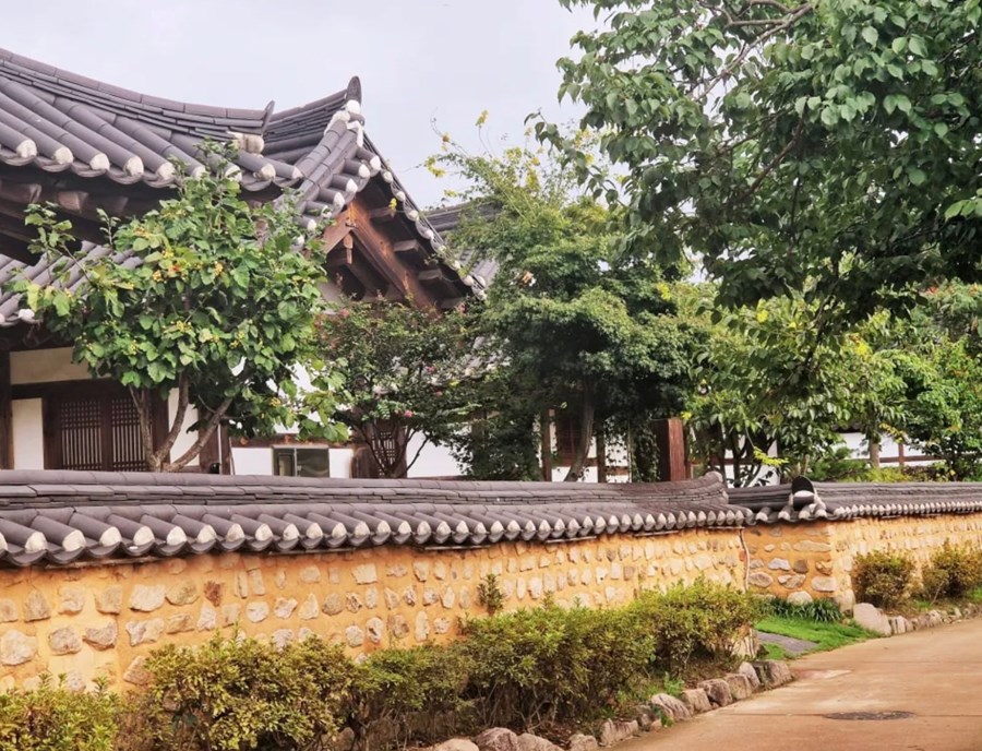 A Street In Gyochon Hanok Village With Traditional Hanoks.