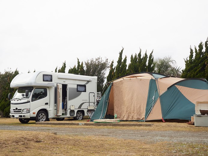 Campervan in Osaka and a tent set up for outdoor camping