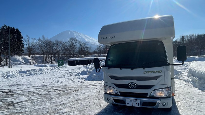 Osaka campervan parked in a winter landscape with snow-covered surroundings