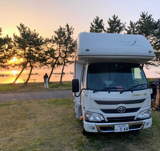 Osaka campervan parked with a scenic sunset view