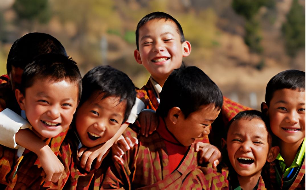 Smiling Bhutanese children in traditional dress laughing together outdoors, capturing the spirit of Bhutan’s Gross National Happiness and community joy.