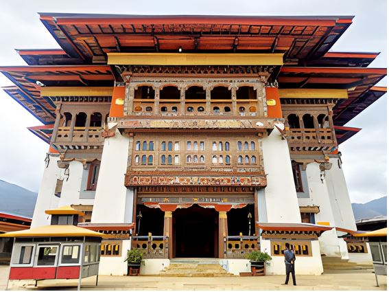 Visitor admiring the intricate exterior of Gangtey Goempa monastery, Bhutan