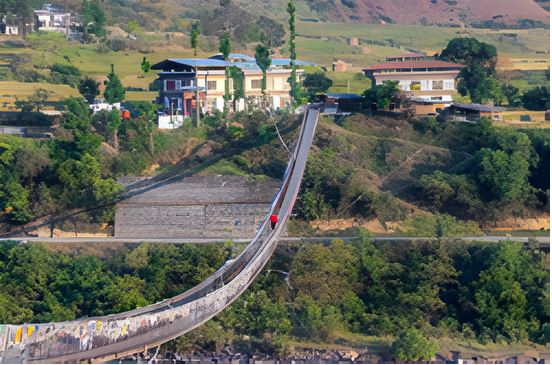 Pho Chhu Suspension Bridge spanning the river in Punakha, Bhutan