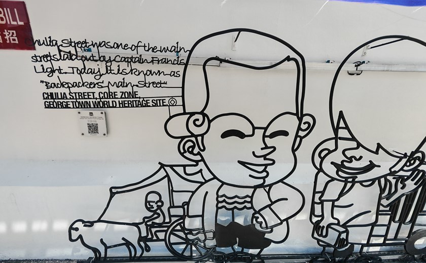 Street art in George Town, Penang, showing a sculpture of kids talking