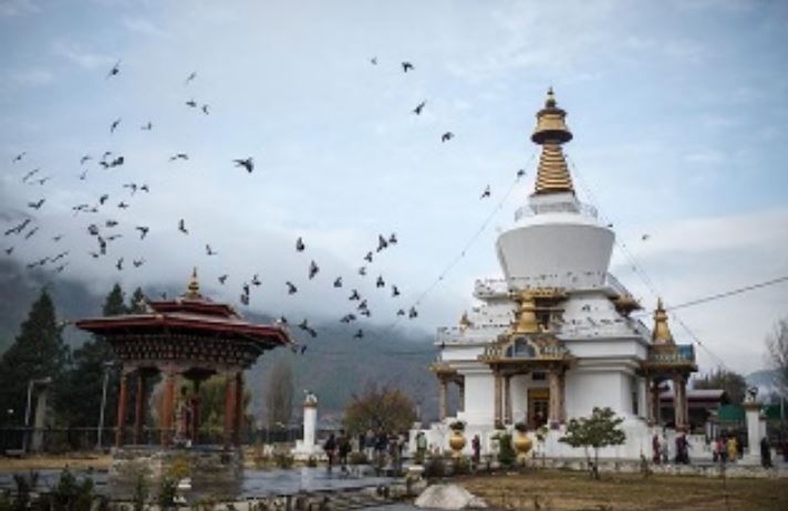 White National Memorial Chorten in Thimphu with golden spire, prayer wheels, and surrounding gardens