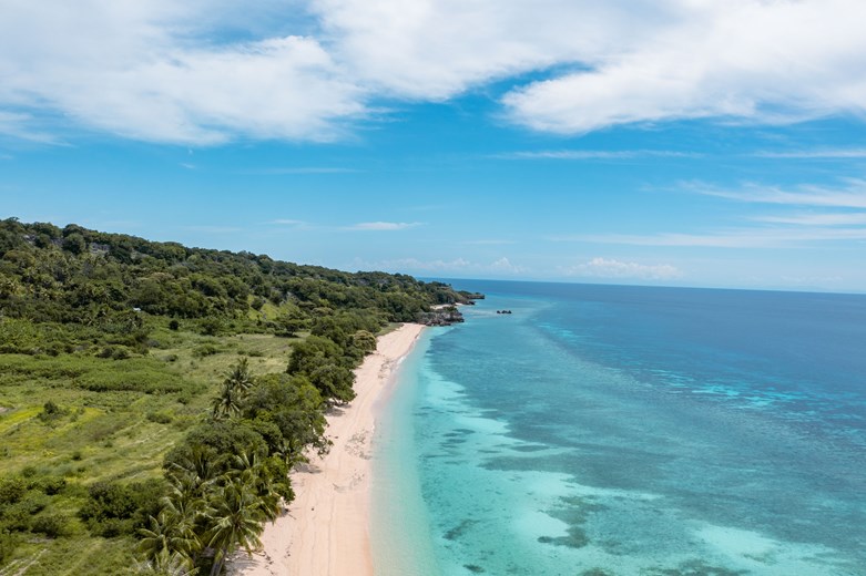 Beach and turquoise ocean along the coast of Timor-Leste