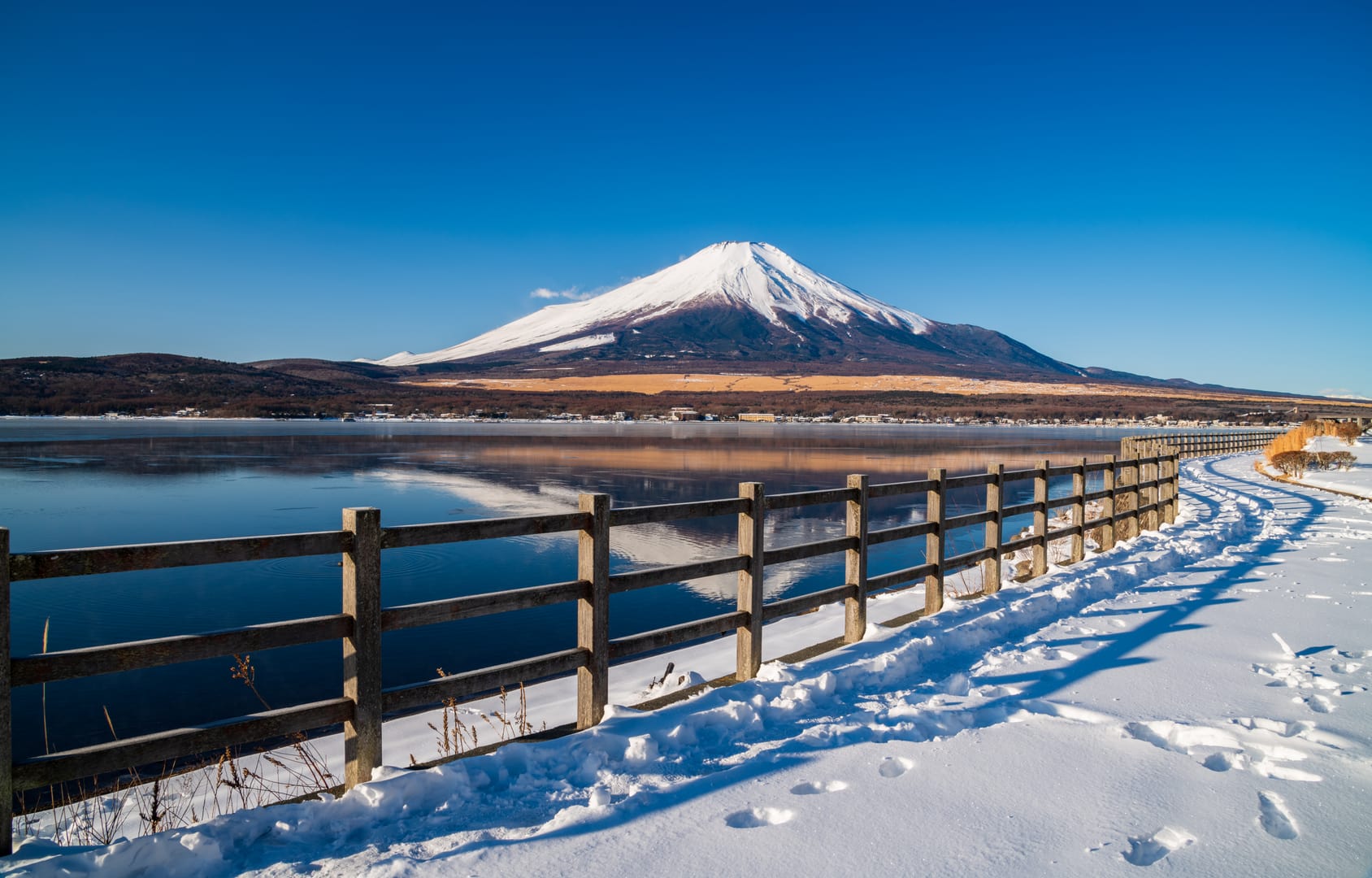 Mount Fuji Rising Above A Serene Winter Landscape