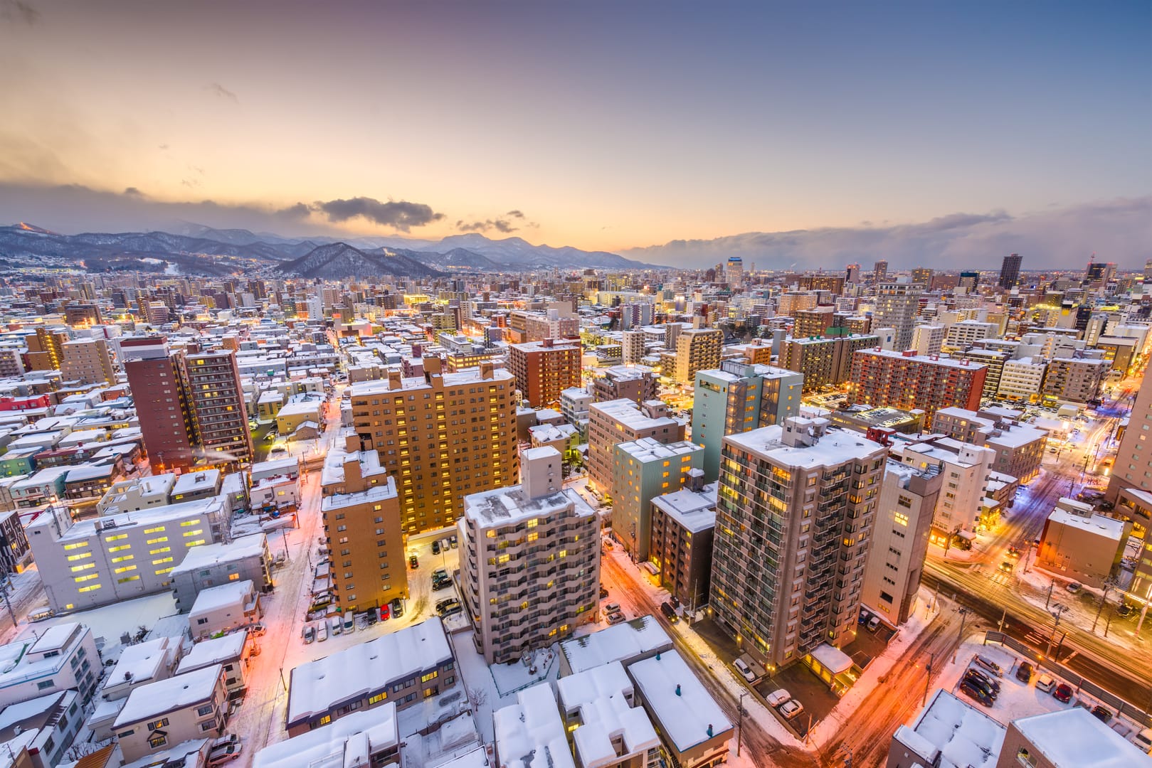 Sapporo Glowing Beneath A Peaceful Winter Snowfall