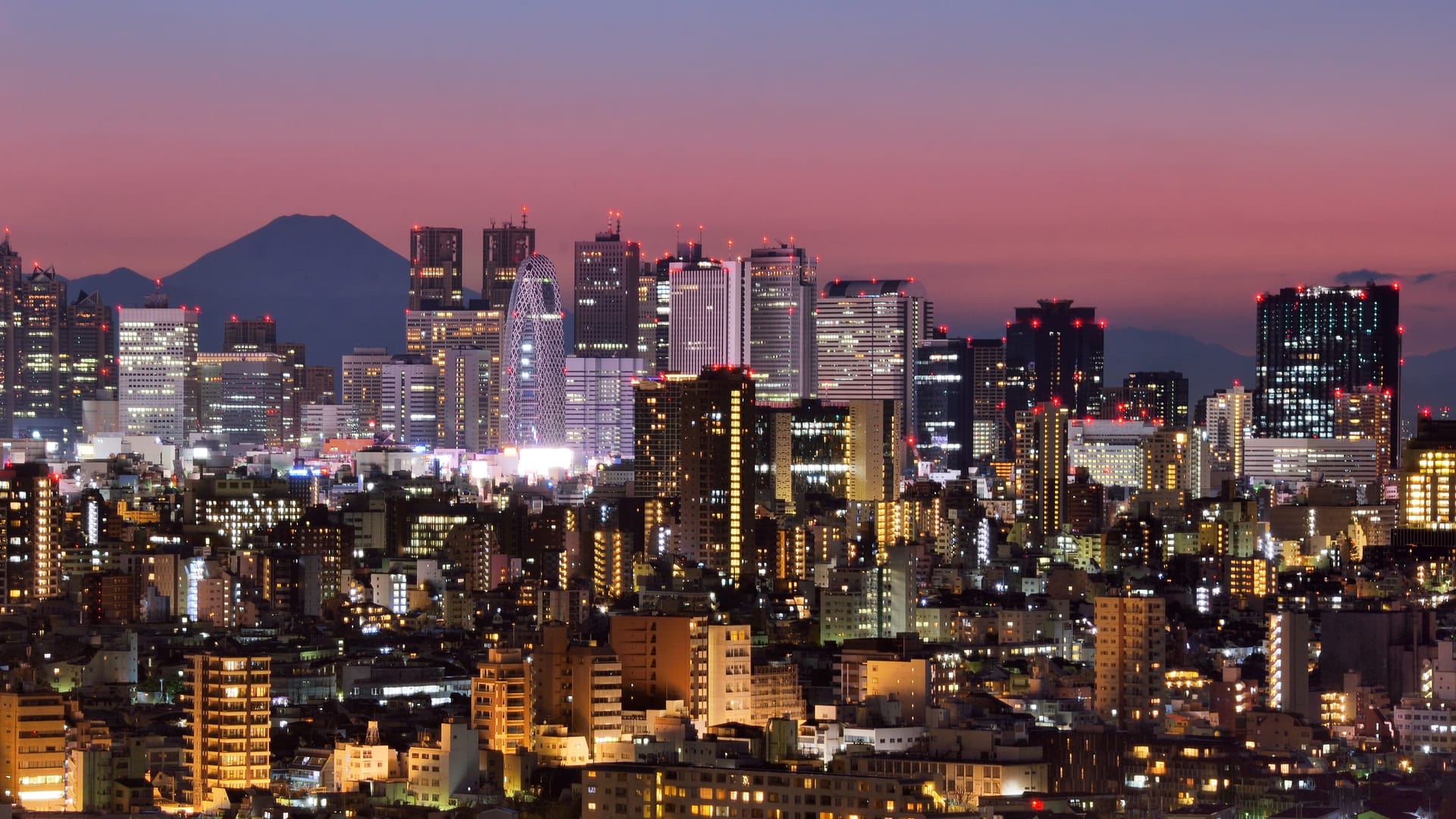 Shinjuku Skyline Glowing Above The Heart Of Vibrant Tokyo